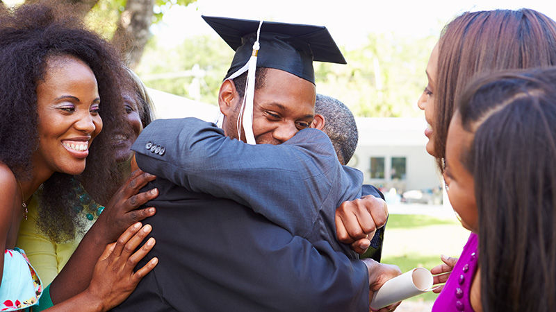 African American Student Celebrates Graduation Smiling